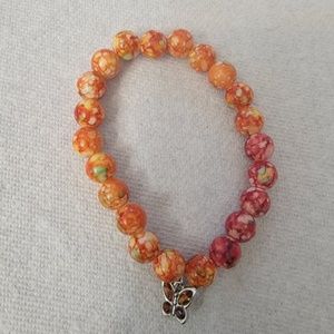 Orange and red beaded bracelet.